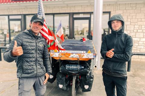 Father and Son traveling across the world ride through Brownfield